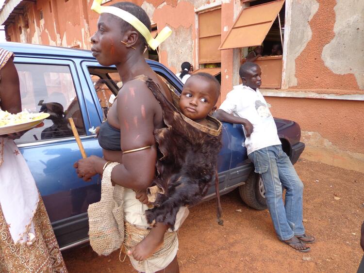 Mwaghavul Woman dress and baby in Back pack called Kuluk